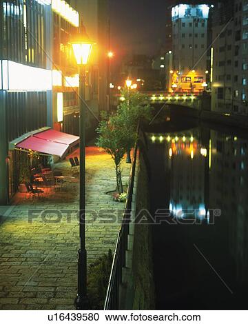 Stock Image - River and Restaurants, Nagoya City, Japan, High Angle View, Long Exposure. Fotosearch