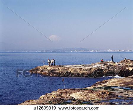 Stock Photo - Fishermen at Seashore of Shonan, Shonan, Kanagawa Prefecture, Japan, High Angle View, Pan Focus. Fotosearch