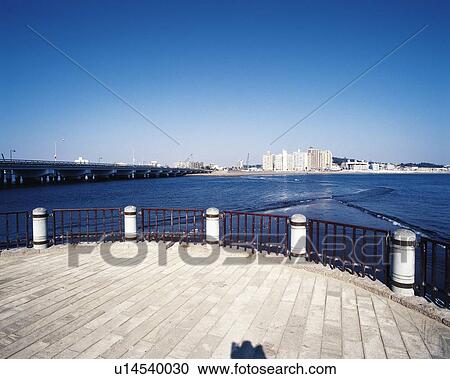 Stock Image - Kataseenoshima, Enoshima Bridge, Shonan, Kanagawa Prefecture, Japan, Low Angle View, Pan Focus. Fotosearch