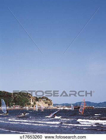 Stock Image - Sailboards in the Ocean, Koshigoe Beach, Shonan, Kanagawa Prefecture, Japan, High Angle View, Pan Focus. Fotosearch