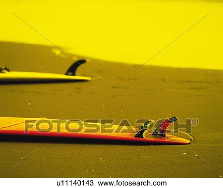 Stock Image - Two Surfboards Laid on Beach, Shonan, Kanagawa Prefecture, Japan, High Angle View, Toned Image. Fotosearch