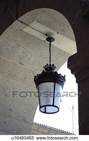 Stock Image - Light hanging in arch. Fotosearch