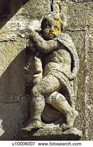 Sculpture on a wall in Santa Maria square View Large Photo Image Stock Photo - Sculpture on a wall in Santa Maria square. Fotosearch