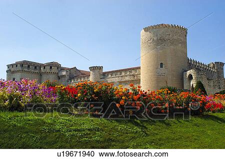 Stock Image - Spanish castle with flowers in the foreground . Fotosearch