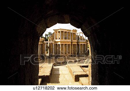 Stock Image - View of spanish architecture through an arch. Fotosearch