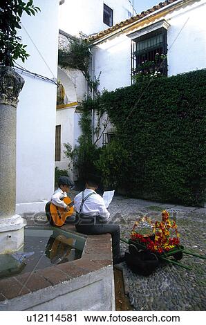 Stock Image - Spain, Andalucia, Andalusia, Cordoba, Street, Alley, Fountain. Fotosearch