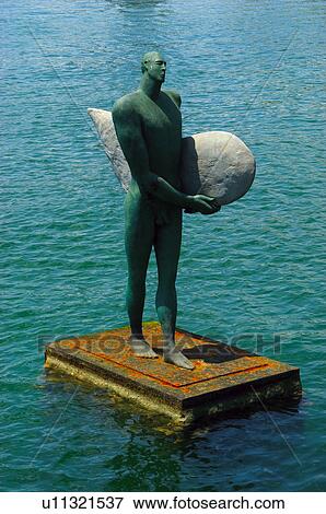 Stock Photo - Spain, Alicante, Art, Statue, Pedestal, Sea. Fotosearch