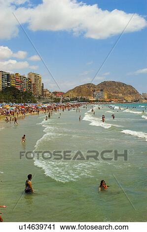 Stock Image - Spain, Alicante, Summer, Beach, Sand, Shore, People. Fotosearch