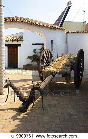 Stock Image - Spain, Andalucia, Andalusia, Huelva, House, Yard, Cart. Fotosearch