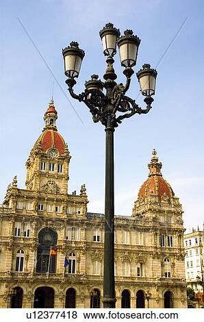 Spanish city hall with a street light in the foreground View Large Photo Image Stock Photo - Spanish city hall with a street light in the foreground . Fotosearch