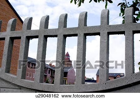 City buildings farmed through a fence View Large Photo Image Stock Image - City buildings farmed through a fence. Fotosearch