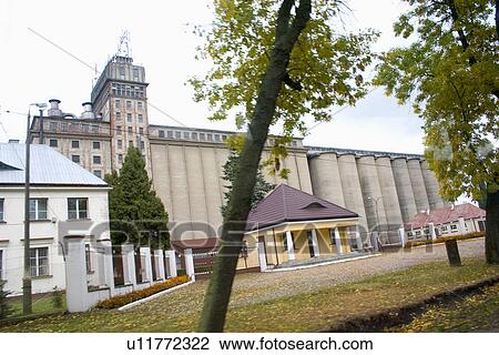 Stock Image - Grain storage elevators and office buildings, Rawa Mazowiecka, Central Poland. Fotosearch