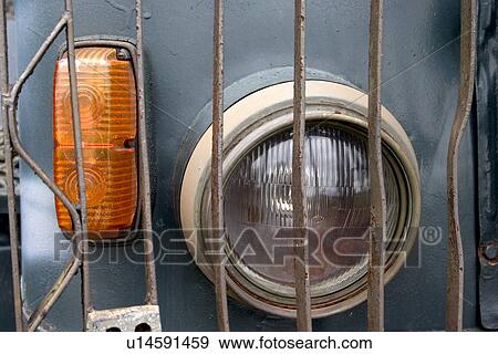 Stock Photo - Headlight on a military truck. Fotosearch
