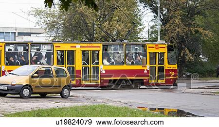 Stock Photo - Passengers riding on the tram, Lodz, Central Poland. Fotosearch