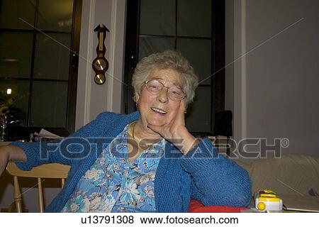 Polish grandmother enjoying a relaxing moment View Large Photo Image Stock Photo - Polish grandmother enjoying a relaxing moment. Fotosearch