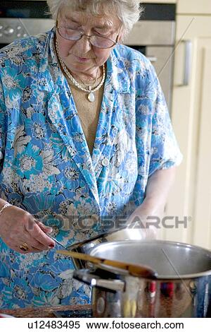 Stock Photography - Polish great grandmother cooking. Fotosearch