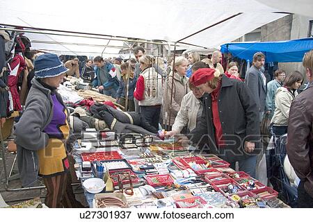 Stock Photo - Shoppers looking at necklaces at the Balucki Rynek market. Fotosearch