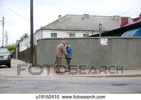 Two friends lighting a cigarette, Rawa Mazowiecka, Central Poland View Large Photo Image Stock Image - Two friends lighting a cigarette, Rawa Mazowiecka, Central Poland. Fotosearch