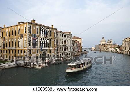 Buildings and cruise boat on canal in Venice, Italy. View Large Photo Image Stock Photography - Buildings and cruise boat on canal in Venice, Italy.. Fotosearch