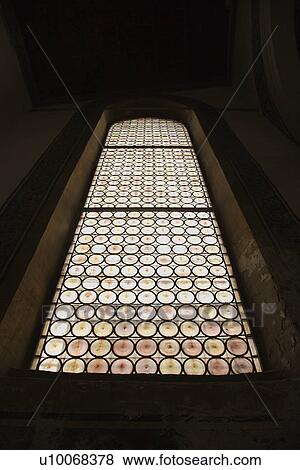 Stock Photo - Indoor low angle view of stained glass window.. Fotosearch