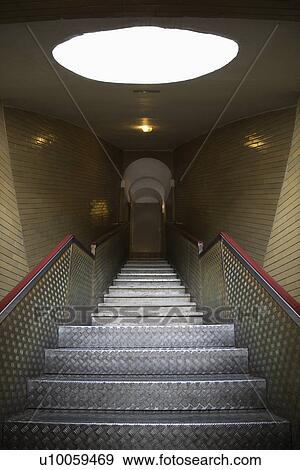 Stock Photo - Interior stairs leading to door.. Fotosearch