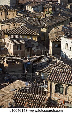 Stock Image - Terra cotta rooftops, Siena, Italy.. Fotosearch