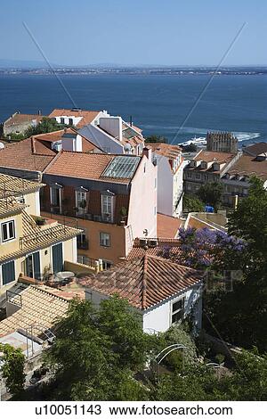 Stock Image - Aerial view of buildings on coast in Lisbon, Portugal.. Fotosearch