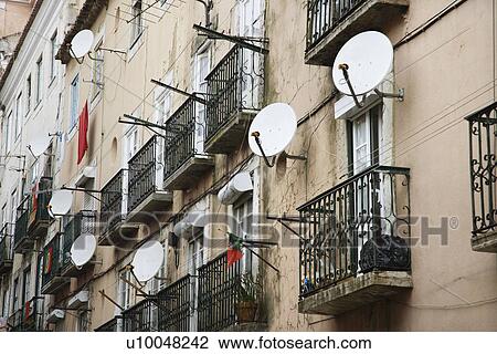 Stock Image - Apartment building with satellite dishes in Lisbon, Portugal.. Fotosearch