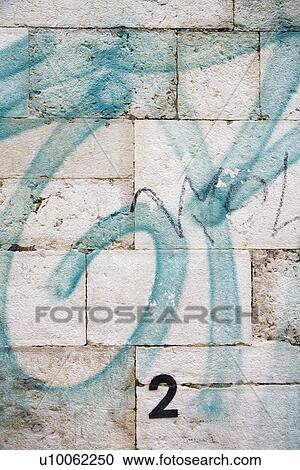Stock Image - Graffiti painted wall in Lisbon, Portugal.. Fotosearch