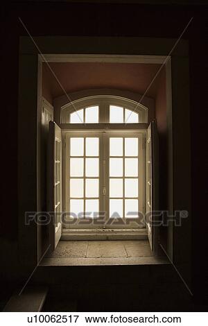 Stock Photo - Interior recessed window lit with sunlight in Lisbon, Portugal.. Fotosearch