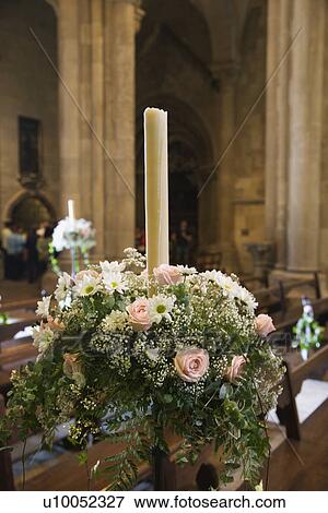 Stock Photo - Interior with flower bouquet and candle of Se Cathedral, Lisbon, Portugal.. Fotosearch