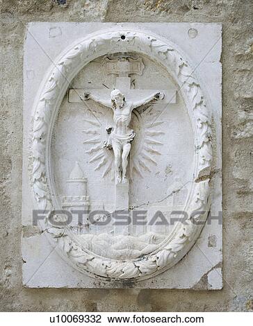 Stock Image - Relief sculpture of Crucifixion in Lisbon, Portugal.. Fotosearch
