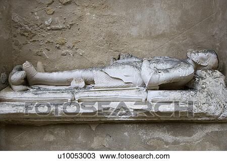 Stock Image - Sculpture memorial of man in Igreja do Carmo, Lisbon, Portugal.. Fotosearch
