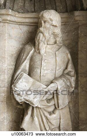 Stock Image - Sculpture of man on exterior of Mosteiro dos Jeronimos in Lisbon, Portugal.. Fotosearch