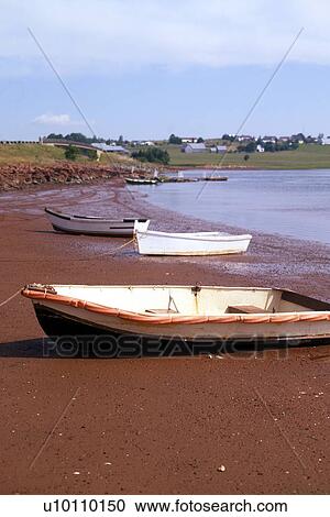 Stock Image - West River beach and boats on red sand. Fotosearch
