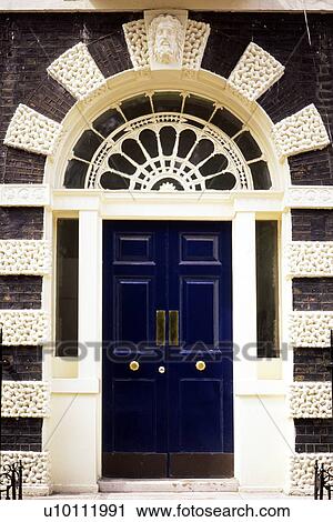 Stock Image - Bedford Square blue door detail. Fotosearch
