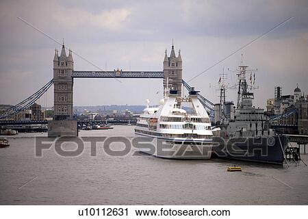 Stock Image - Tower Bridge with Battleship Belfast and cruise ship. Fotosearch