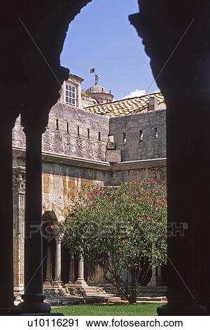 Stock Image - Arles - cloister of Eglise de Trophime. Fotosearch