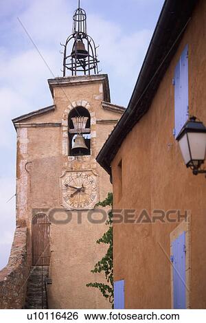 Stock Photograph - Roussillon - detail of house and church. Fotosearch