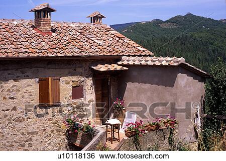 Entrance into old stone house with red tiled roof Tuscany Italy View Large Photo Image Stock Photograph - Entrance into old stone house with red tiled roof Tuscany Italy. Fotosearch