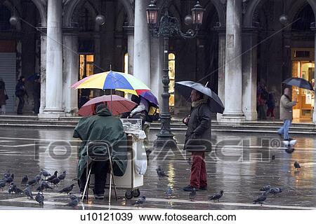 Stock Photo - Bird food seller in St Marks Piazza. Fotosearch