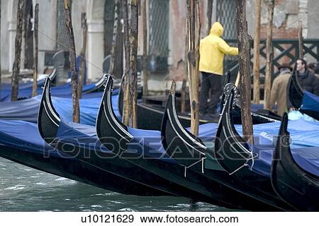 Gondolas moored at canal side View Large Photo Image Stock Photo - Gondolas moored at canal side. Fotosearch