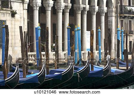 Stock Photograph - Gondolas moored at canal side. Fotosearch