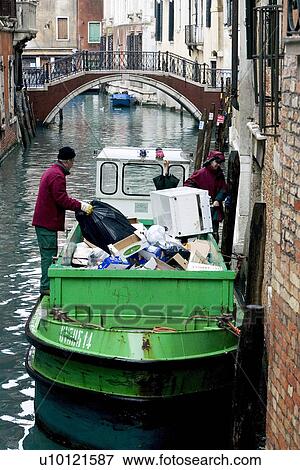 Green garbage barge on canal View Large Photo Image Stock Photo - Green garbage barge on canal. Fotosearch