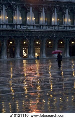 Stock Image - Lighted arcade in St Marks Piazza. Fotosearch