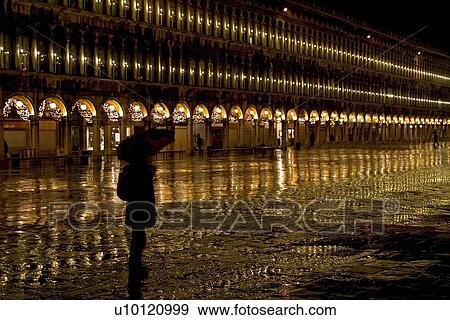 Stock Photo - Lighted arcade in St Marks Piazza. Fotosearch