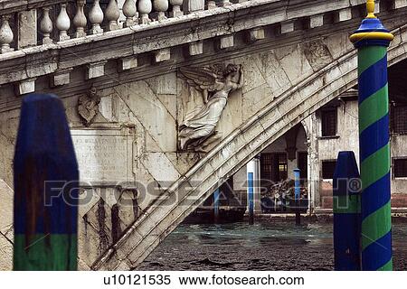 Stock Photography - stone winged angel on side of Rialto Bridge. Fotosearch