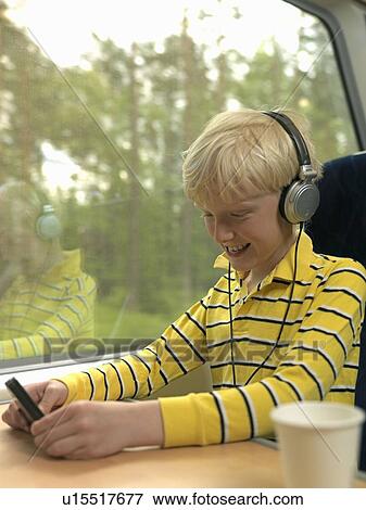 Stock Photo - Boy on train. Fotosearch