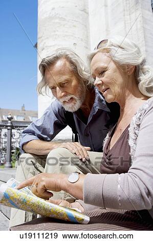 Stock Photo - Couple looking at map together. Fotosearch