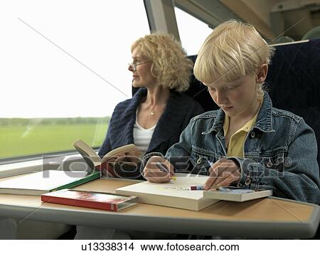 Grandmother and grandson on train View Large Photo Image Picture - Grandmother and grandson on train. Fotosearch
